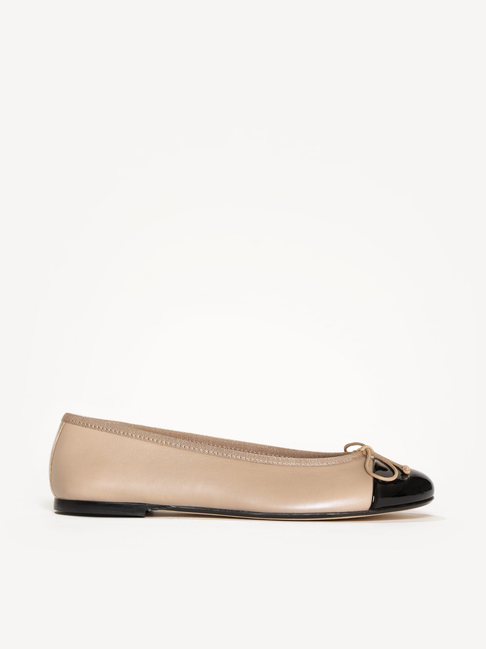 M.Gemi The Rosa beige ballet flat with a black patent cap toe and bow.