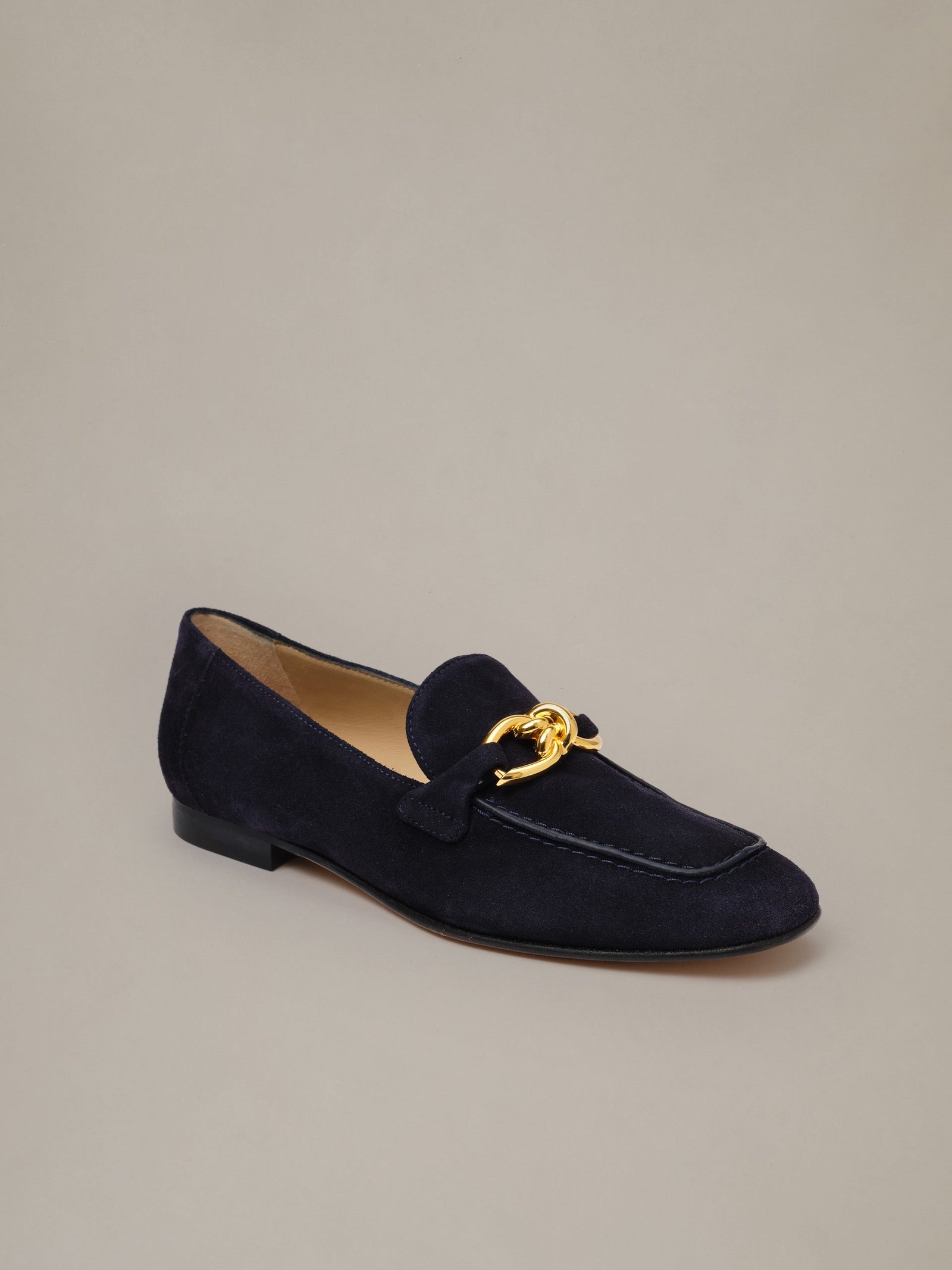 J.McLaughlin Mila navy suede loafer with gold-tone knot hardware.