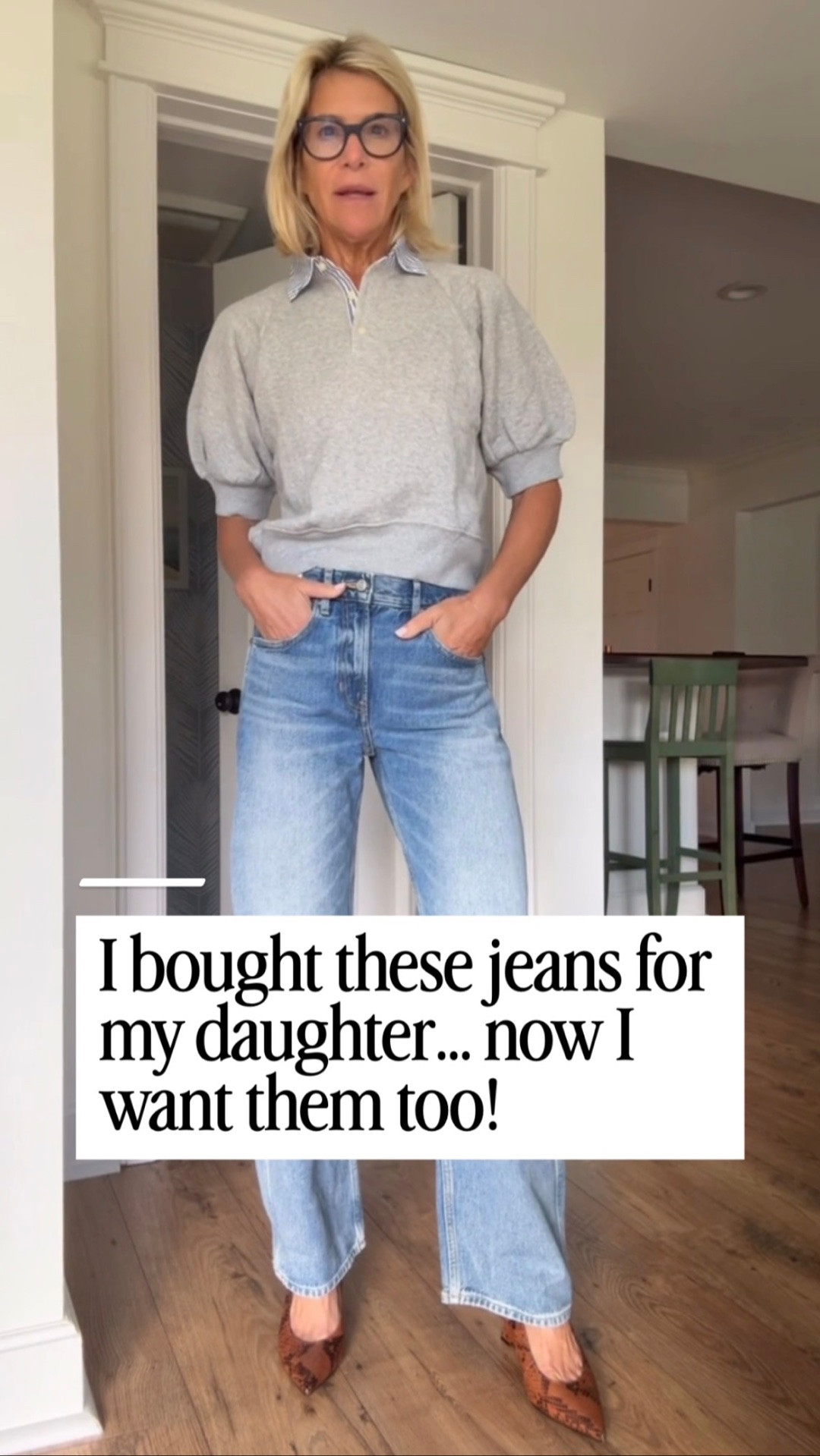 A soft gray collared puff-sleeve top with light wide-leg jeans.